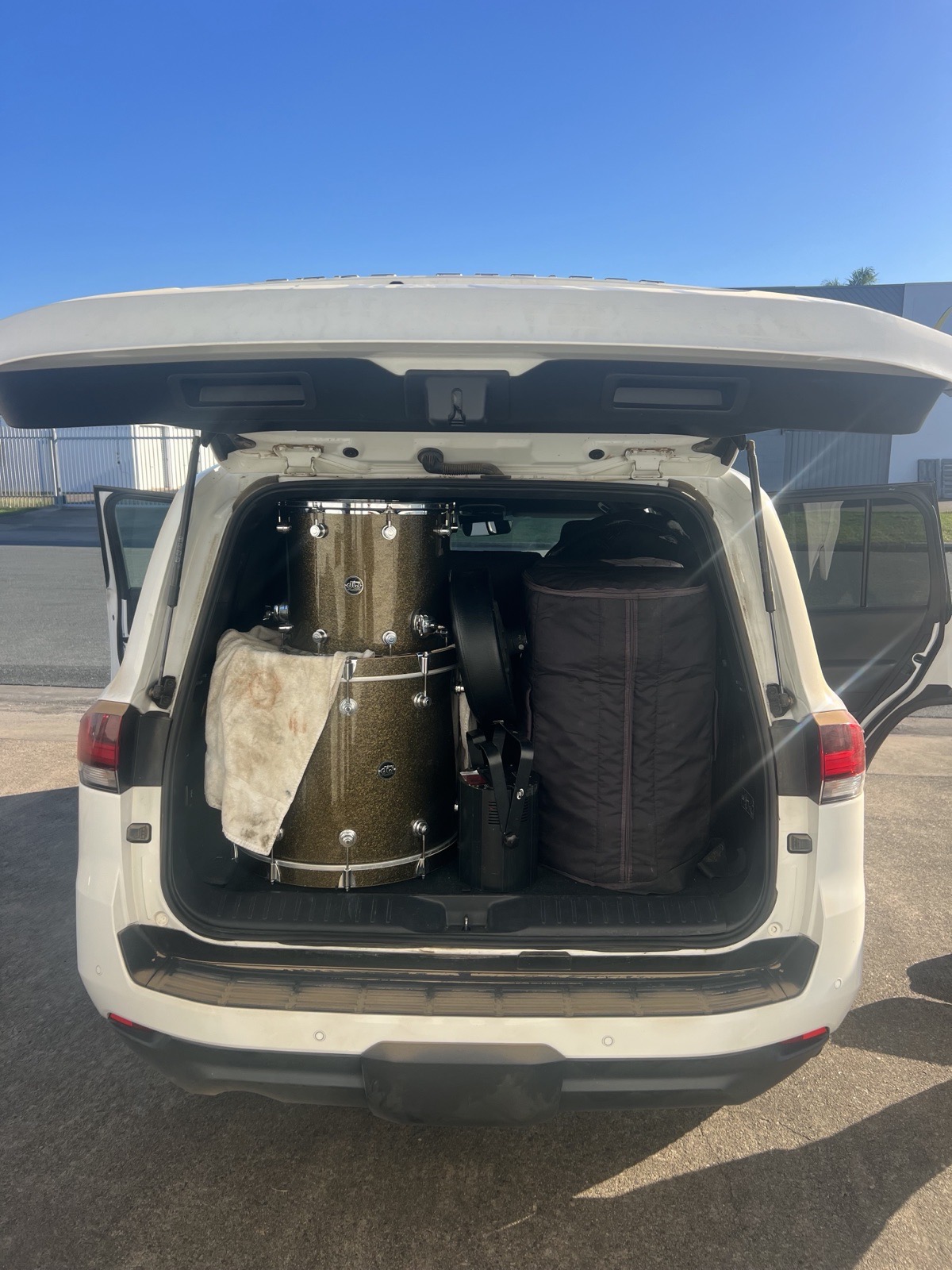 Full acoustic drum kit, sound production and guitar amplification packed for destination wedding travel to Mackay