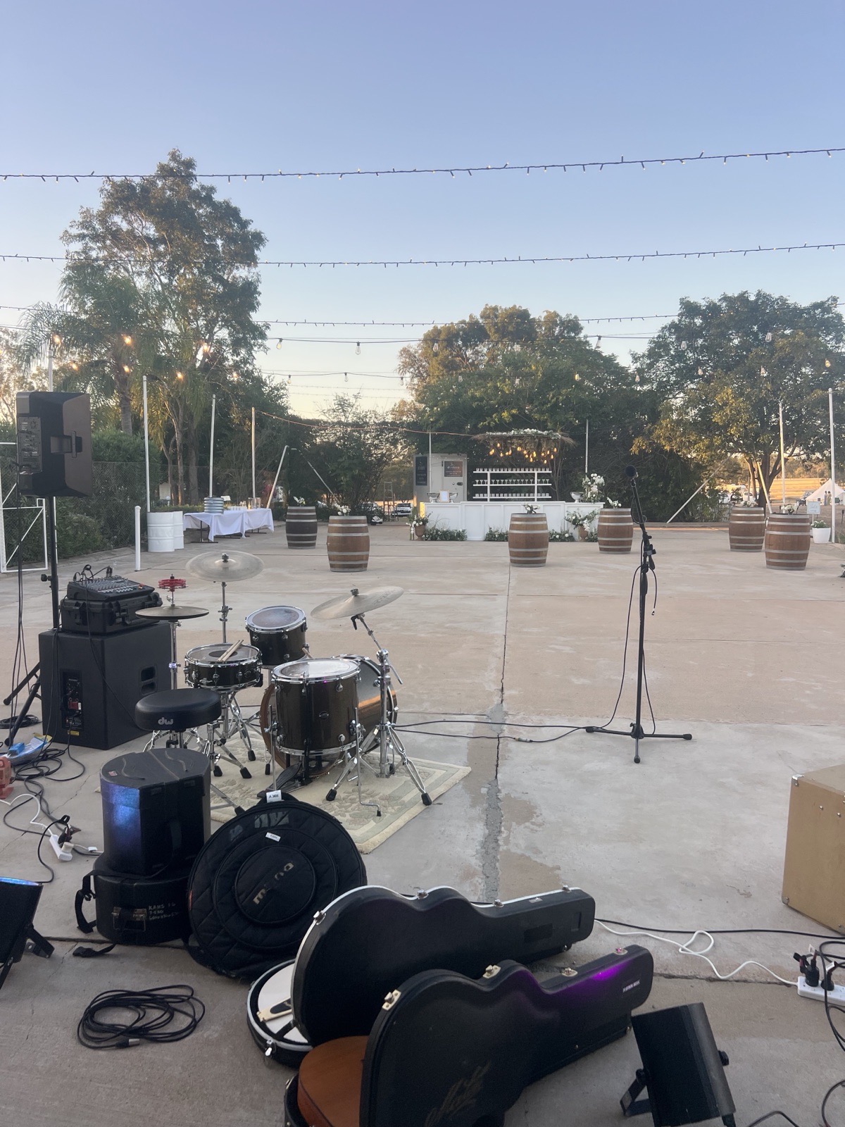 Charter Music live band setup and dancefloor under festoon lights at Kemmis Station
